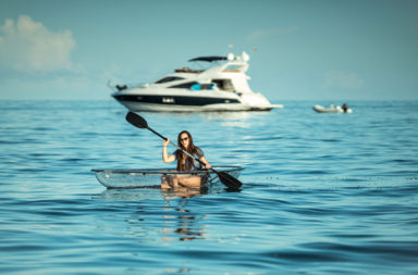 Girl Paddling Crystal Explorer Clear Kayak